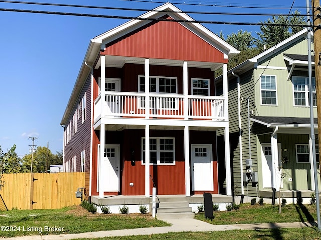 view of front of property with a balcony and a porch