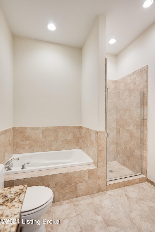 bathroom with tile floors, shower with separate bathtub, and toilet