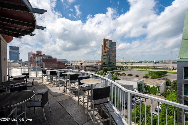 view of patio featuring a balcony