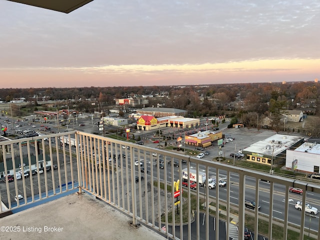 view of balcony at dusk