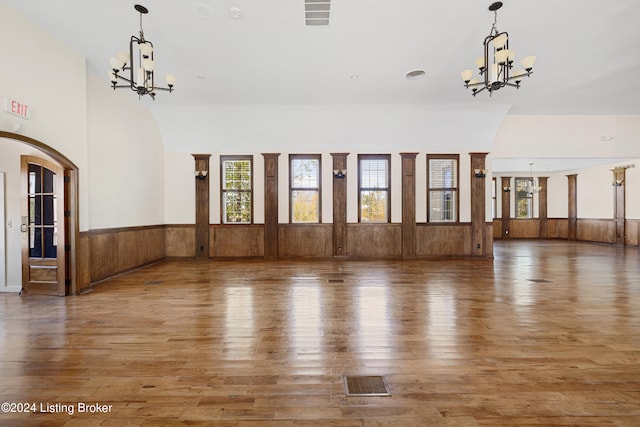 interior space with an inviting chandelier and hardwood / wood-style floors