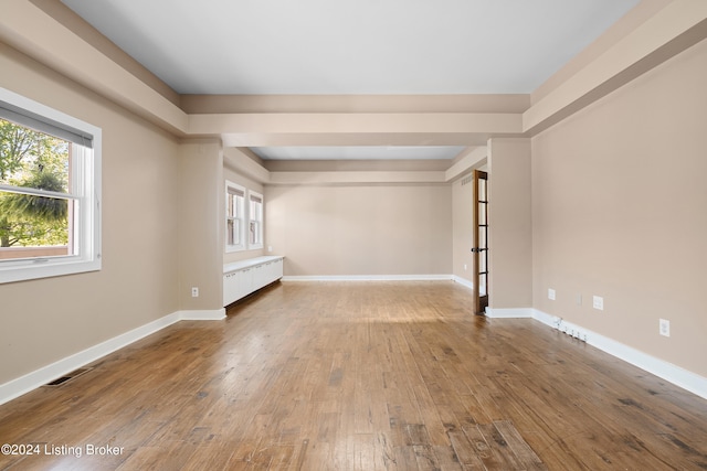 unfurnished room featuring wood-type flooring