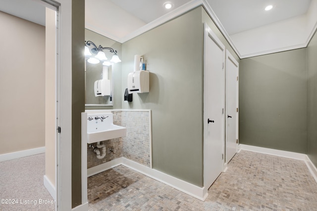 bathroom featuring tile flooring and sink