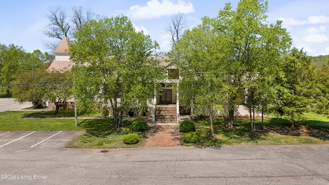 view of property hidden behind natural elements