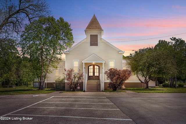 view of outdoor building at dusk