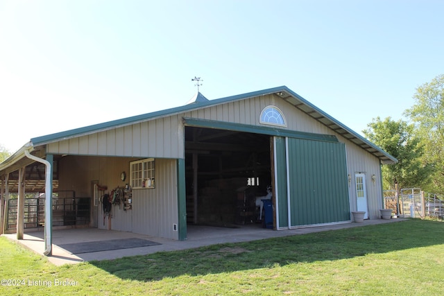 exterior space with an outdoor structure and a yard