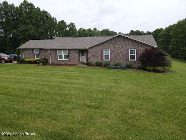 single story home with a front lawn