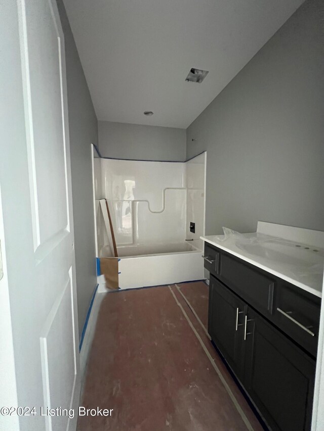 bathroom featuring vanity and concrete flooring