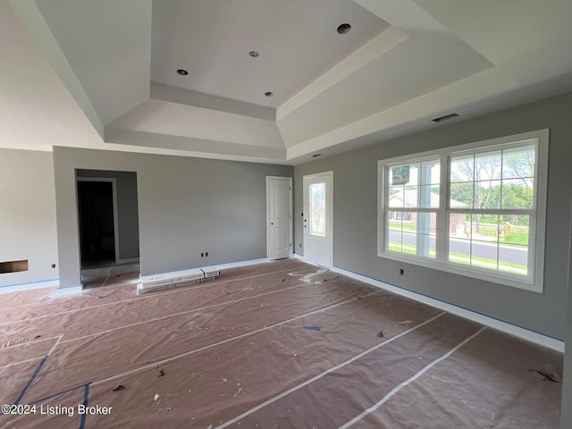 empty room with a tray ceiling