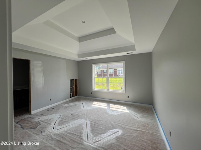 empty room with a tray ceiling