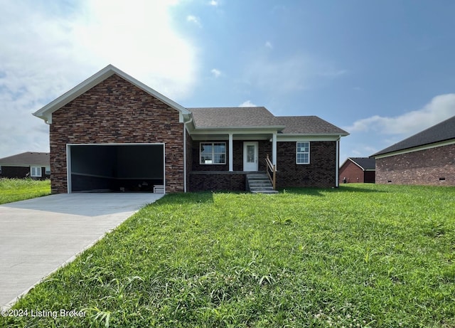 single story home featuring a garage and a front lawn