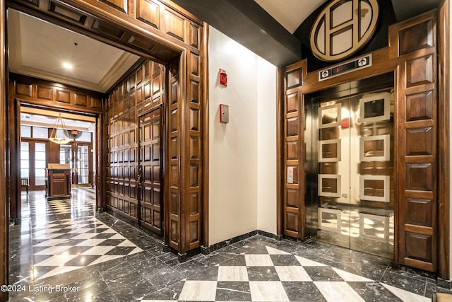 corridor with tile floors and crown molding