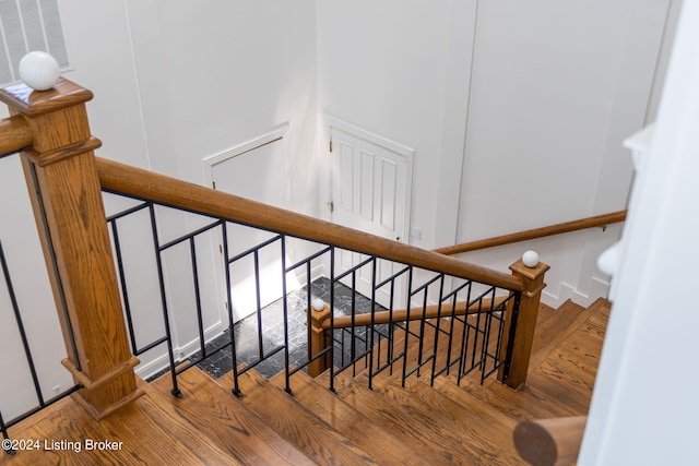 stairway with wood-type flooring