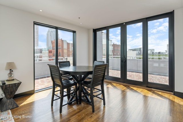 dining area featuring french doors and hardwood / wood-style flooring