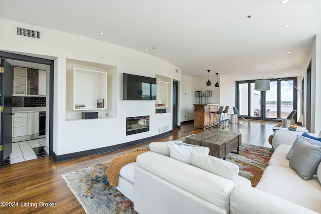 living room with dark hardwood / wood-style floors