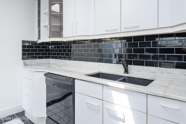 kitchen with dishwasher, white cabinetry, tasteful backsplash, and tile floors