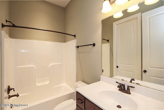 full bathroom featuring shower / bath combination, vanity, and toilet