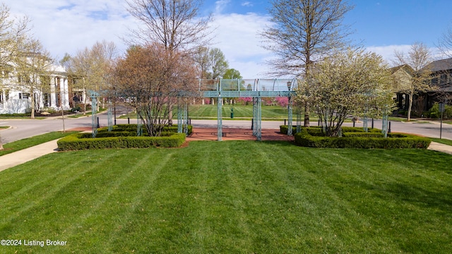 view of property's community with a lawn