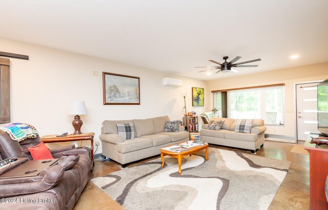 living room with concrete floors, ceiling fan, and a wall mounted air conditioner