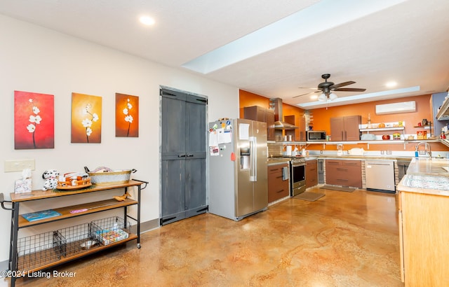 kitchen featuring stainless steel appliances, a wall mounted AC, ventilation hood, a barn door, and ceiling fan