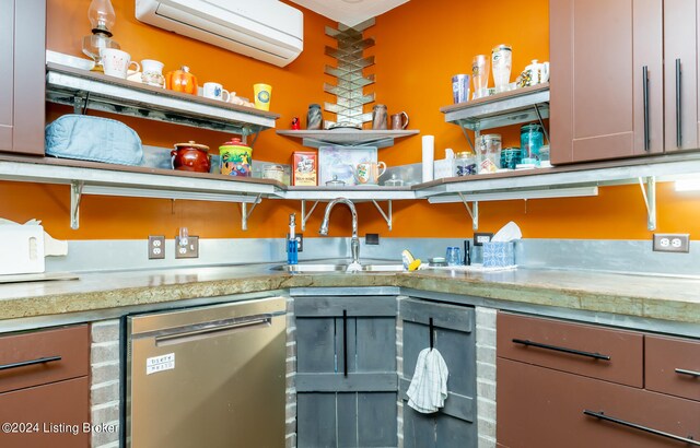 kitchen with sink, a wall mounted air conditioner, and stainless steel dishwasher