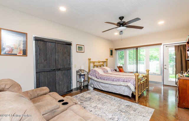 bedroom with a textured ceiling, ceiling fan, and access to exterior