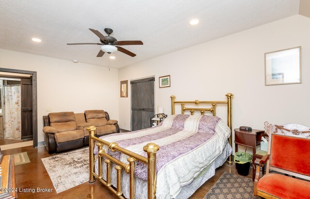 bedroom with a textured ceiling and ceiling fan