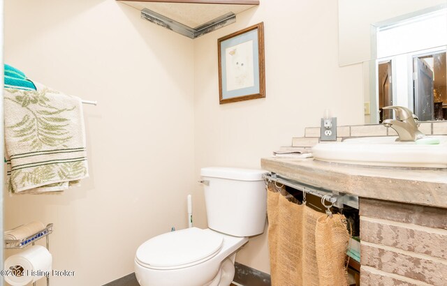 bathroom with sink and toilet