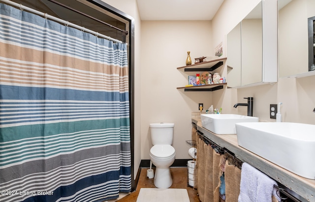 bathroom with oversized vanity and toilet