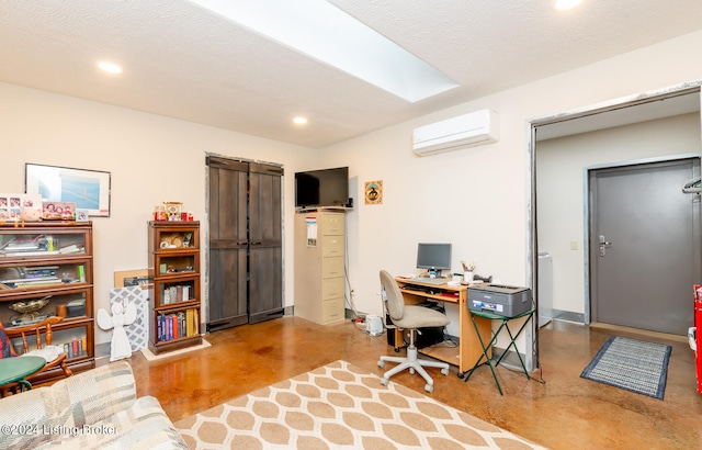 office space with concrete floors, a textured ceiling, and a wall mounted AC