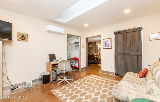 office space featuring a wall unit AC, concrete floors, and a textured ceiling