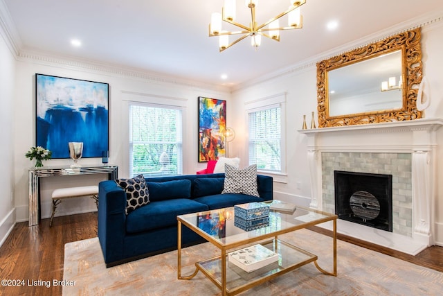 living room featuring a chandelier, wood-type flooring, and crown molding