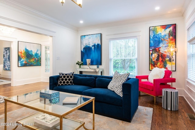 living room featuring dark hardwood / wood-style flooring and crown molding