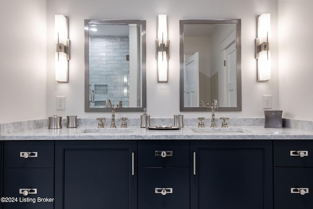 bathroom featuring vanity and a tile shower