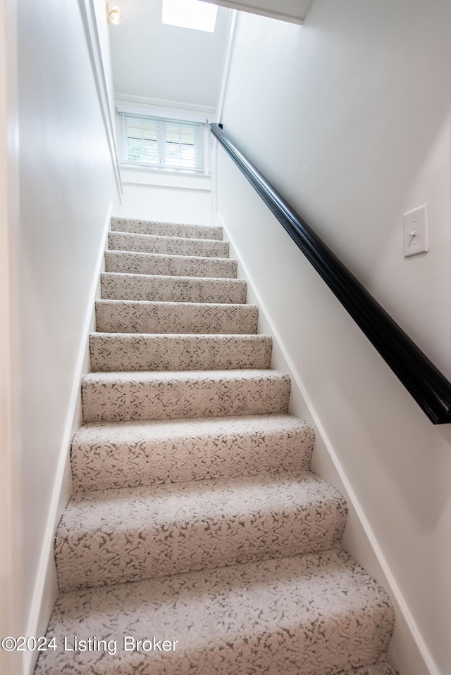 stairway with a skylight