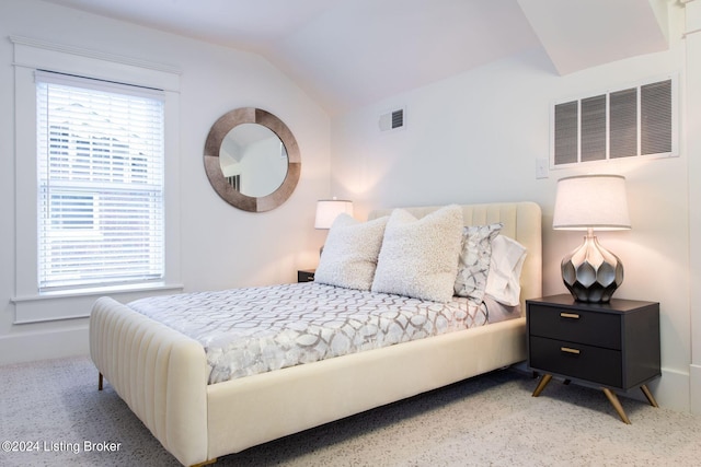 bedroom featuring lofted ceiling