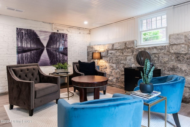 sitting room featuring wood-type flooring