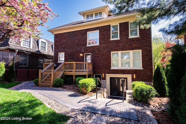 view of front facade featuring french doors and a deck