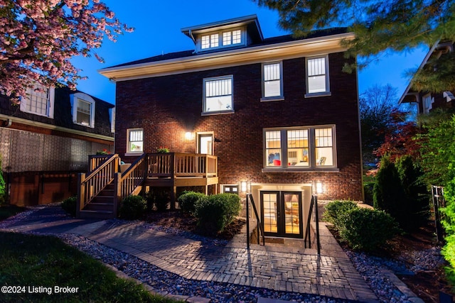 view of front of home featuring french doors and a deck