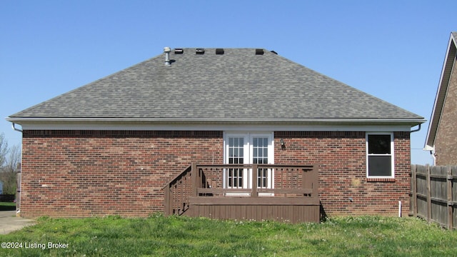 rear view of house featuring french doors and a wooden deck