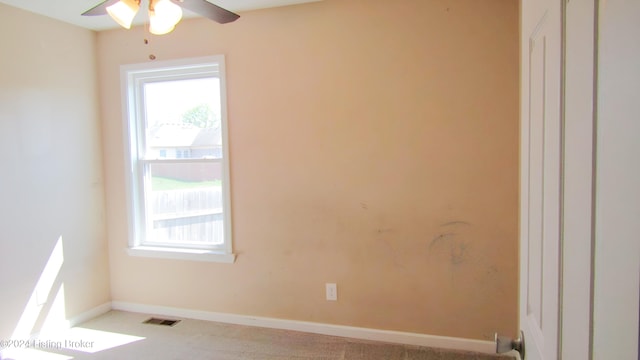 spare room with carpet flooring and ceiling fan