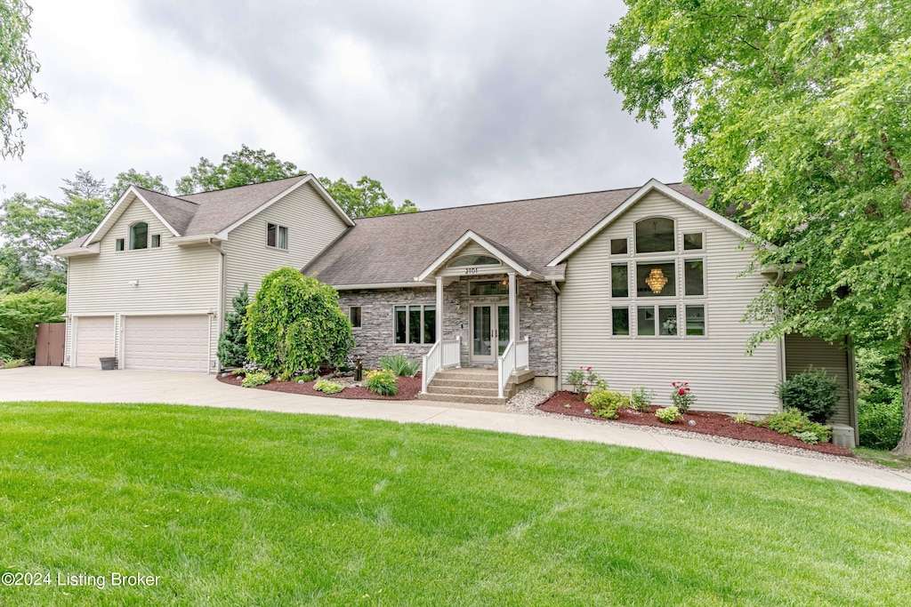 view of front facade with a front lawn and a garage