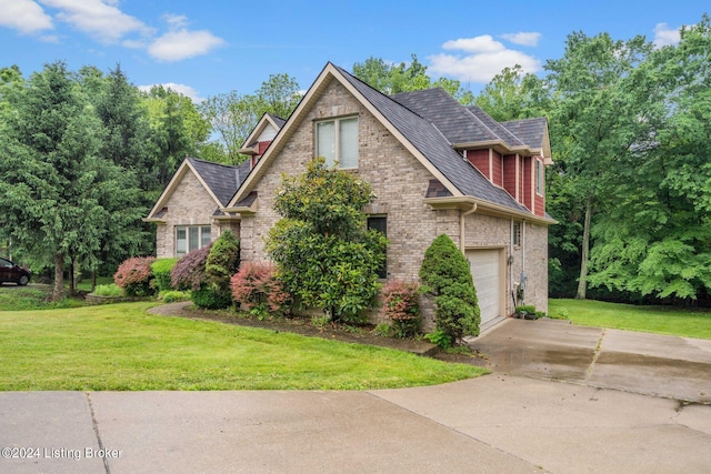 view of front of home with a garage and a front yard