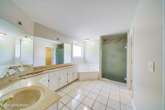 bathroom with tile patterned floors, independent shower and bath, and vanity