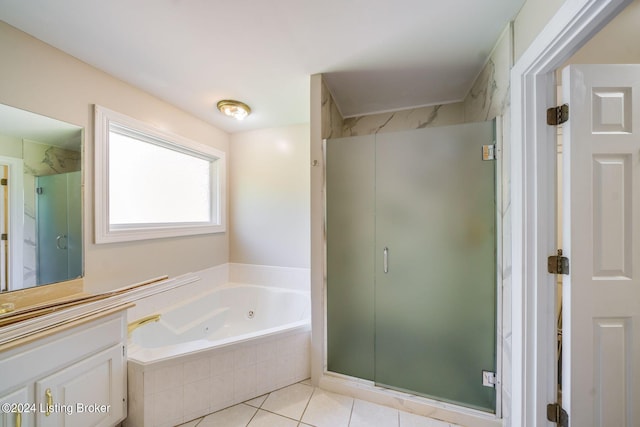 bathroom featuring independent shower and bath, vanity, and tile patterned floors