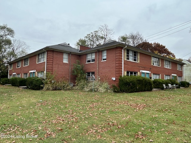 view of property exterior featuring a lawn