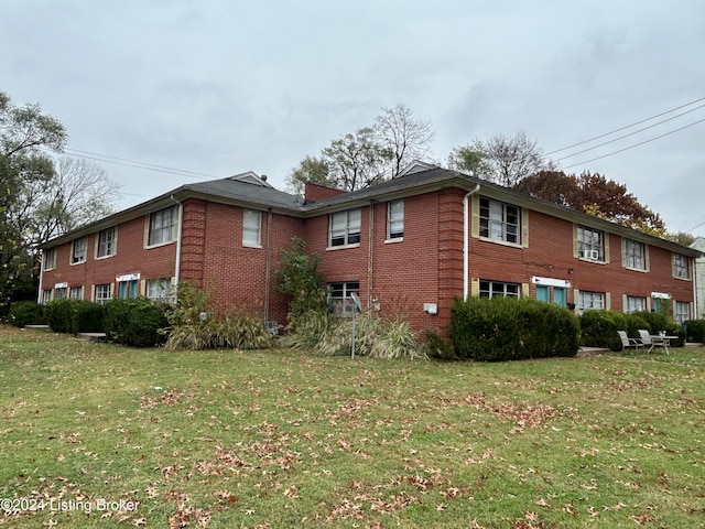 view of home's exterior with a lawn