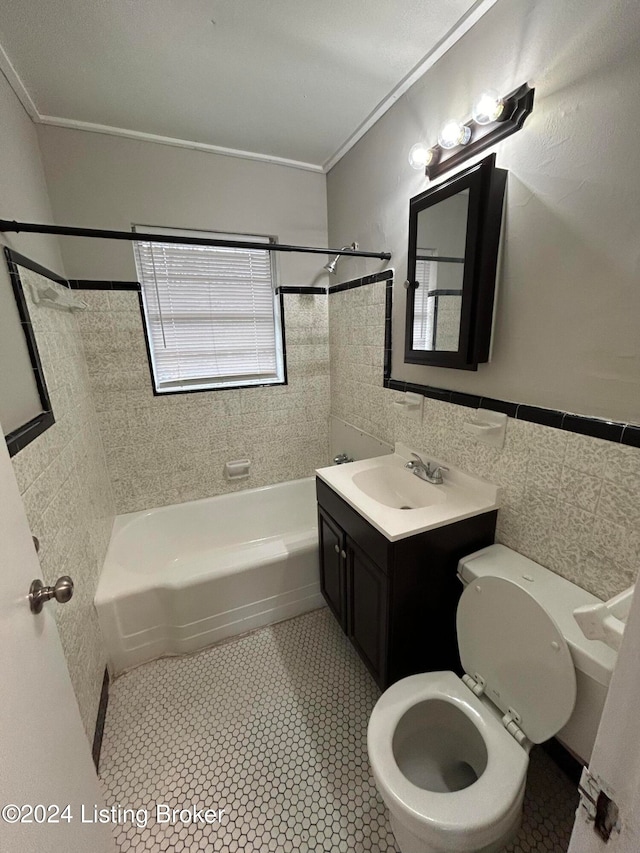 full bathroom featuring vanity, tile walls, tile patterned flooring, and ornamental molding