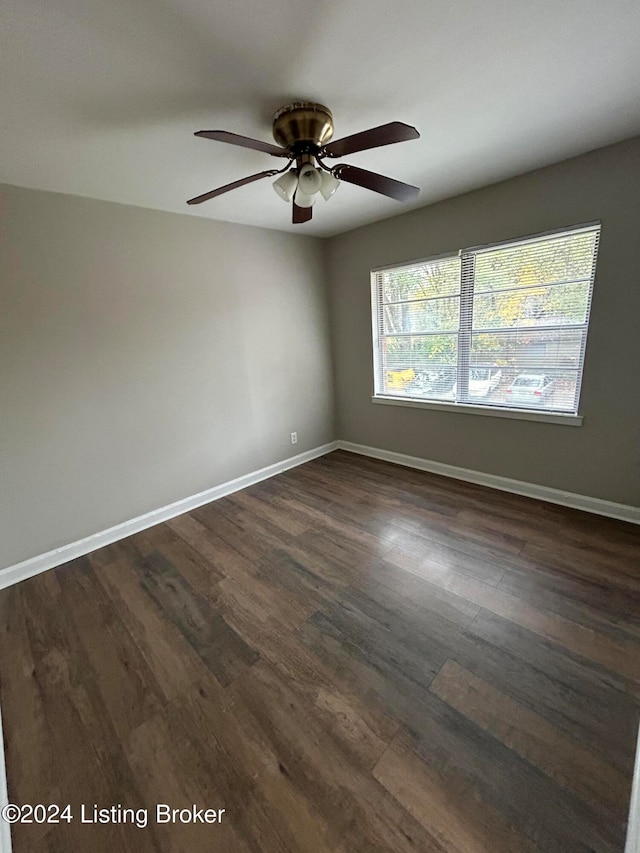 unfurnished room featuring dark hardwood / wood-style flooring and ceiling fan