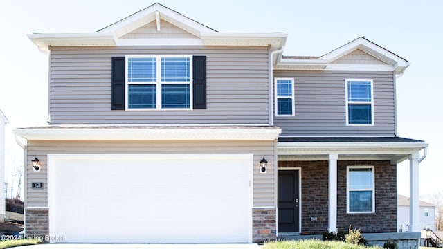 view of front of property with a porch and a garage